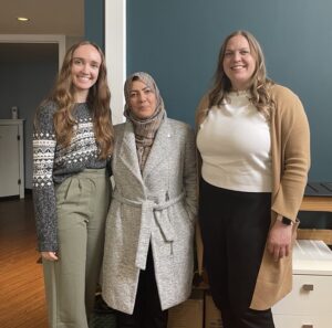 Nazira Safi standing in between two TPC staff members.