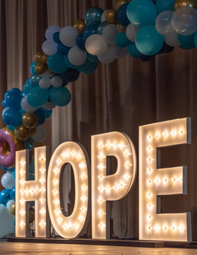 HOPE marquee sign with balloon arch