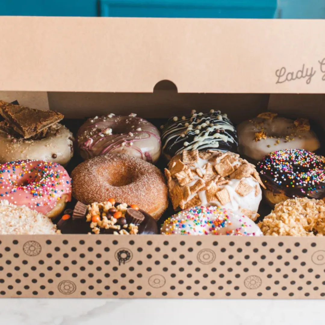 Dozen_D4H 12 decorated donuts in a box